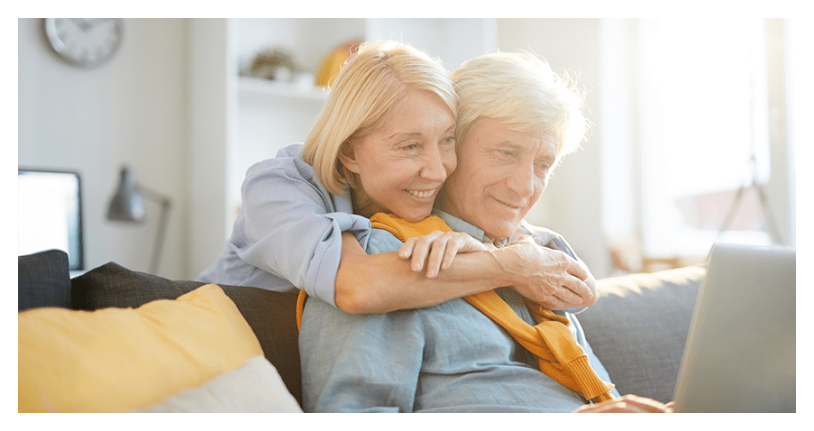 Happy mature couple reading hearing health articles