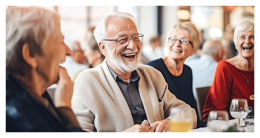 Mature man out with friends laughing happy he can hear clearly again